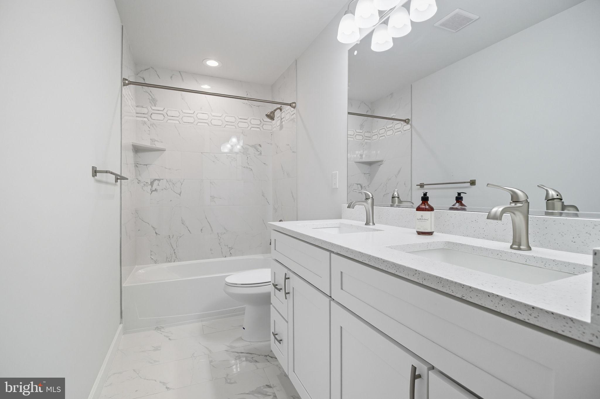 18518 Old Triangle Road Triangle, VA 22172 - Photo 33 of 39 a bathroom with a sink a toilet and shower