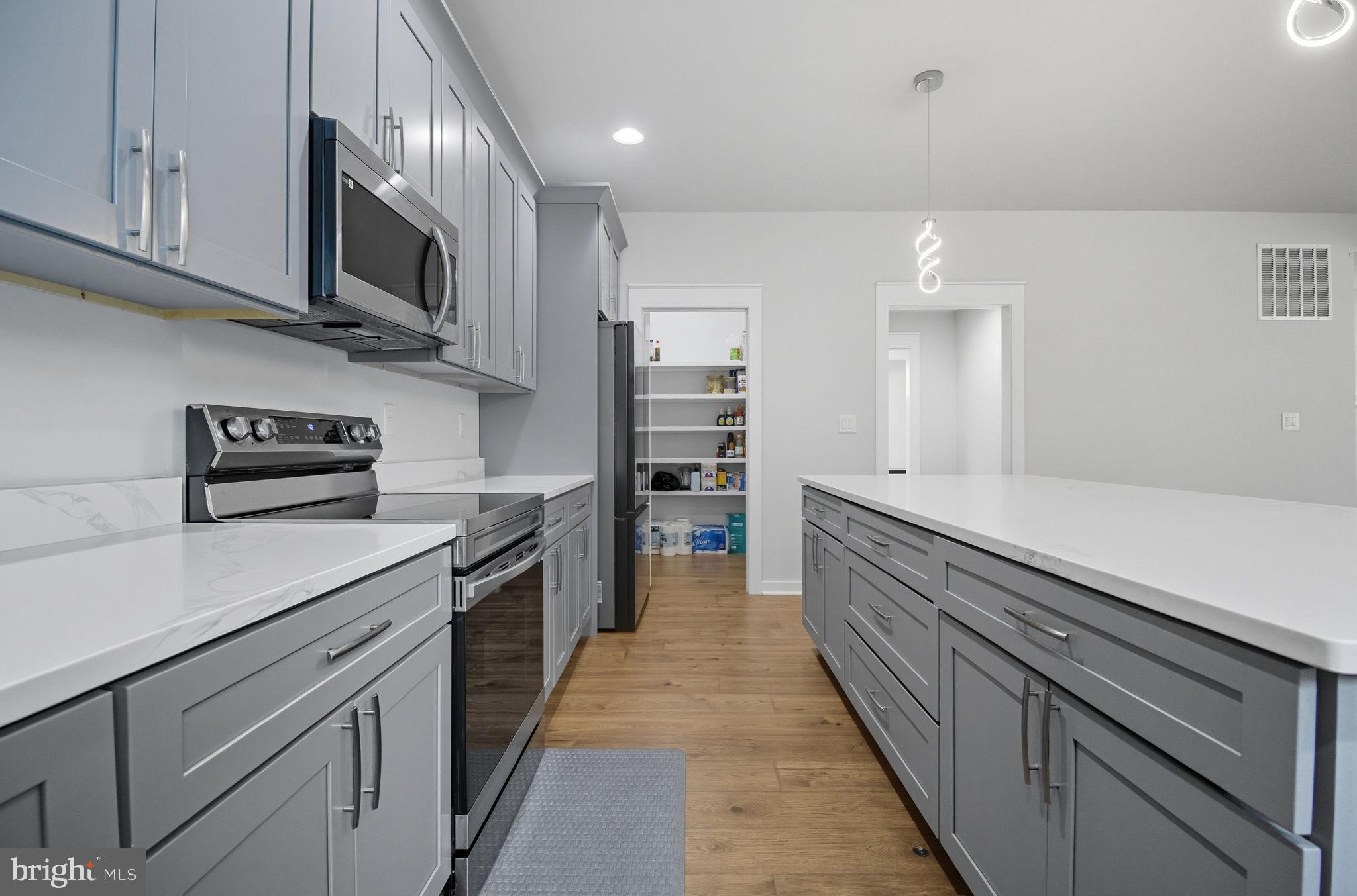 18518 Old Triangle Road Triangle, VA 22172 - Photo 8 of 39 a large kitchen with cabinets