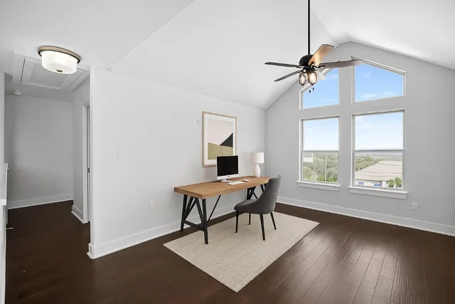 a work room with furniture and wooden floor
