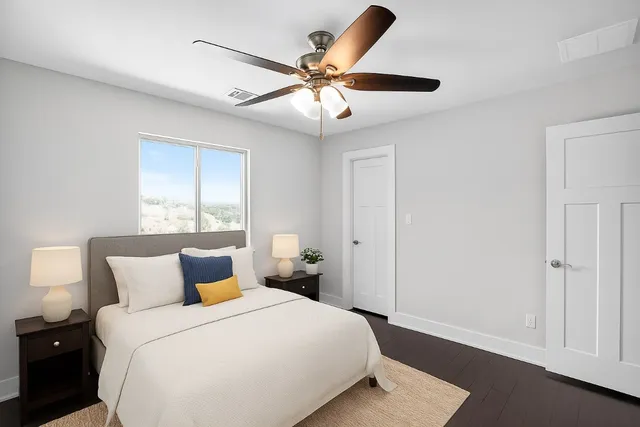 a bedroom with a bed and window