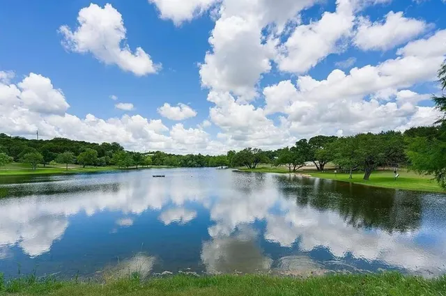 a view of a wooden floor with a lake view