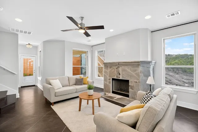 a living room with furniture and a fireplace