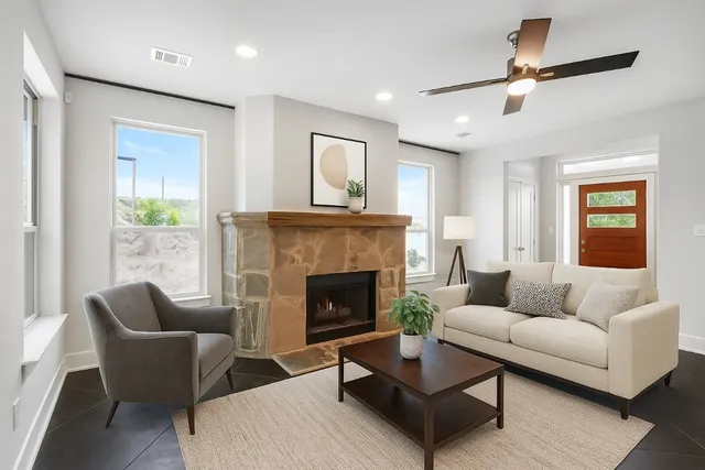 a living room with furniture and a fireplace