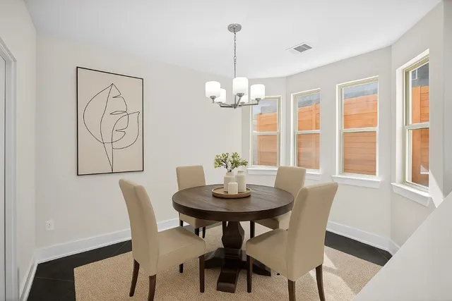 a view of a dining room with furniture window and outside view