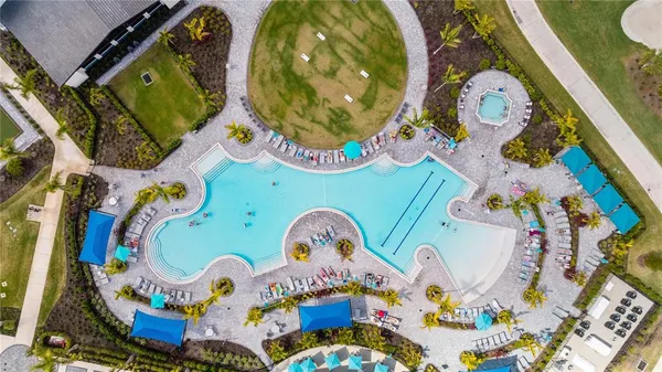 an aerial view of a swimming pool patio and mountain view