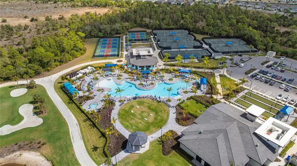 an aerial view of a houses with outdoor space and lake view