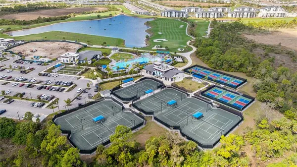 a view of a swimming pool with a yard