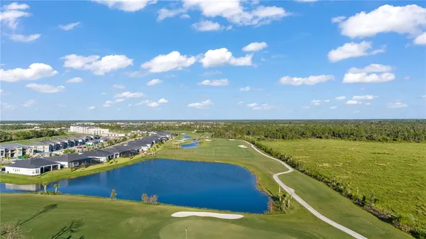 a view of a golf course with a lake