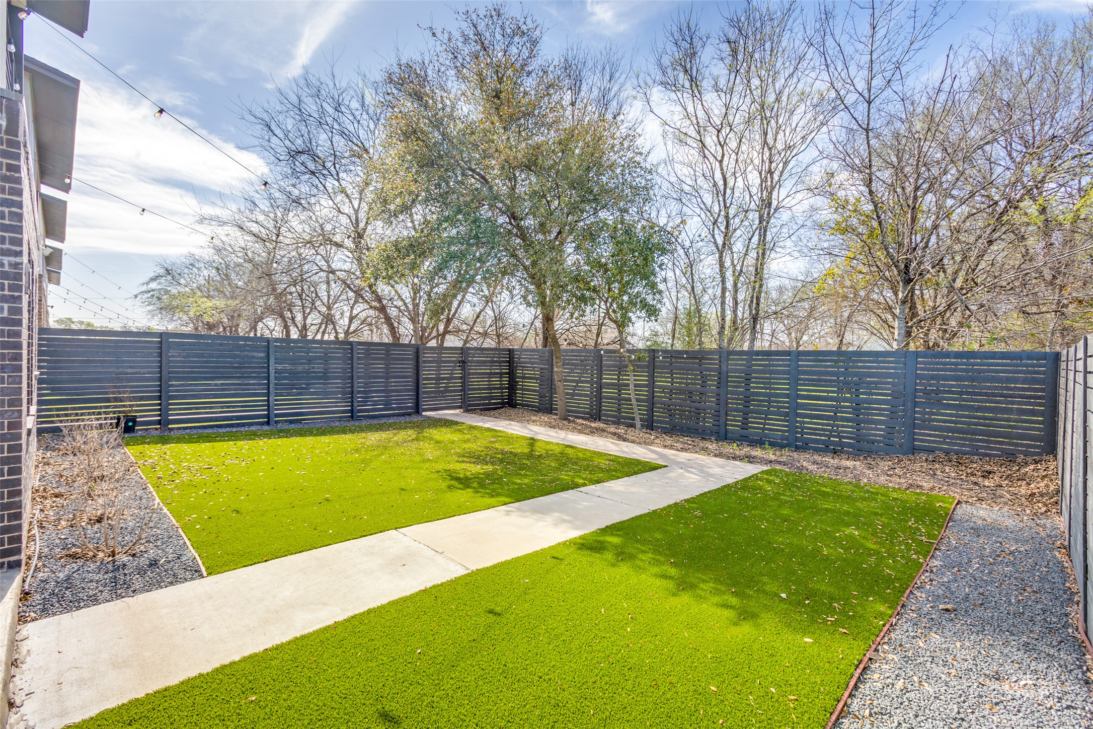 5002 Pecan Springs Road, Unit 10 Austin, TX 78723 - Photo 26 of 29 View of yard featuring a fenced backyard