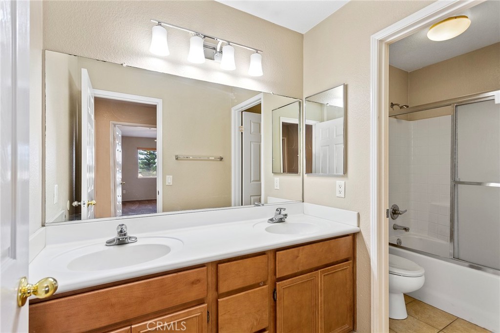 8061 Palm View Lane Riverside, CA 92508 - Photo 12 of 23 a bathroom with a sink and a mirror