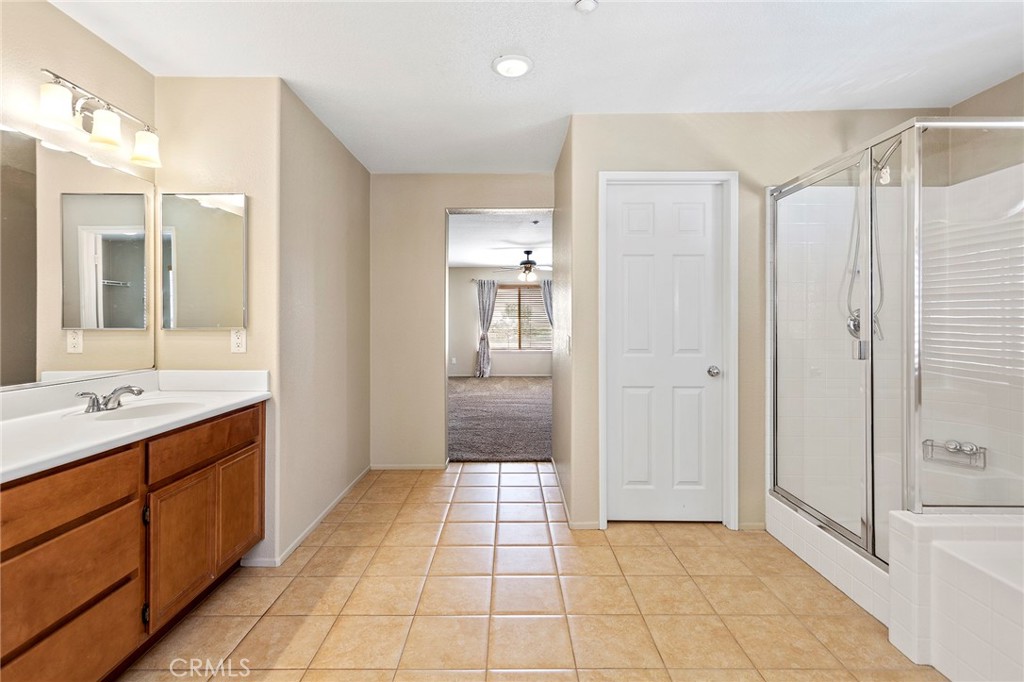 8061 Palm View Lane Riverside, CA 92508 - Photo 19 of 23 a bathroom with a shower and a sink
