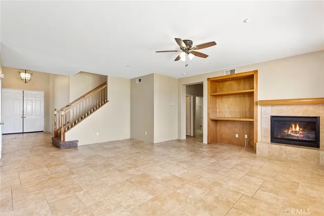 a view of an empty room with a fireplace