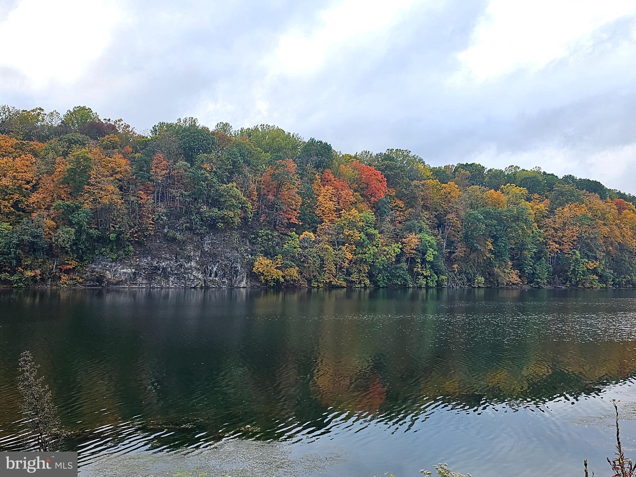 7 Ranger Falling Waters, WV 25419 - Photo 19 of 35 a view of a lake with a mountain in the background