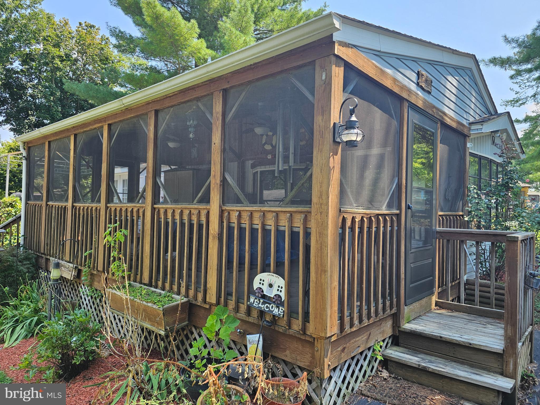 7 Ranger Falling Waters, WV 25419 - Photo 3 of 35 a view of a porch with a floor to ceiling window and wooden fence