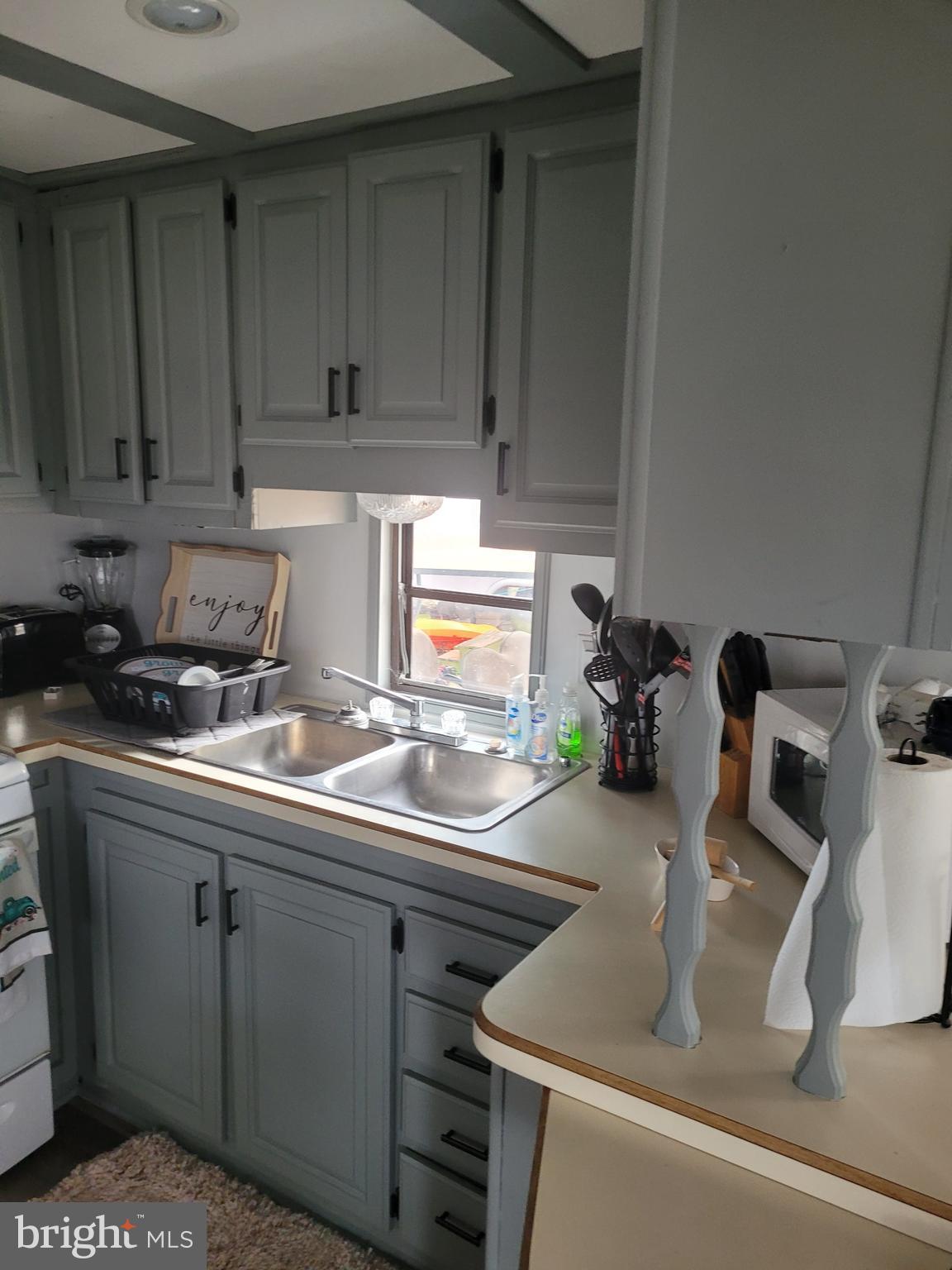 7 Ranger Falling Waters, WV 25419 - Photo 32 of 35 a kitchen with a sink and cabinets