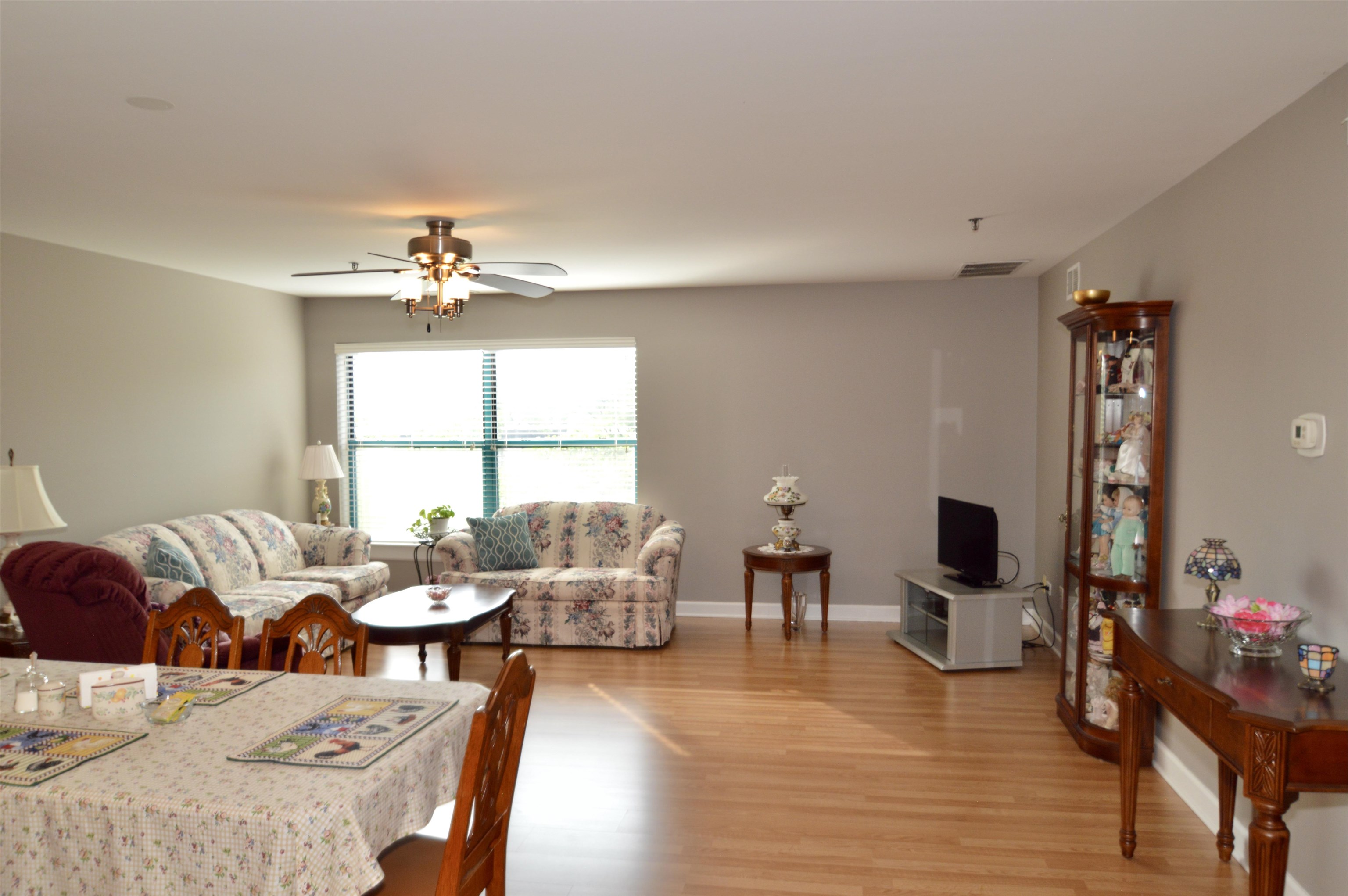 3265 Kirchoff Road Rolling Meadows, IL 60008 - Photo 6 of 14 a living room with furniture and wooden floor