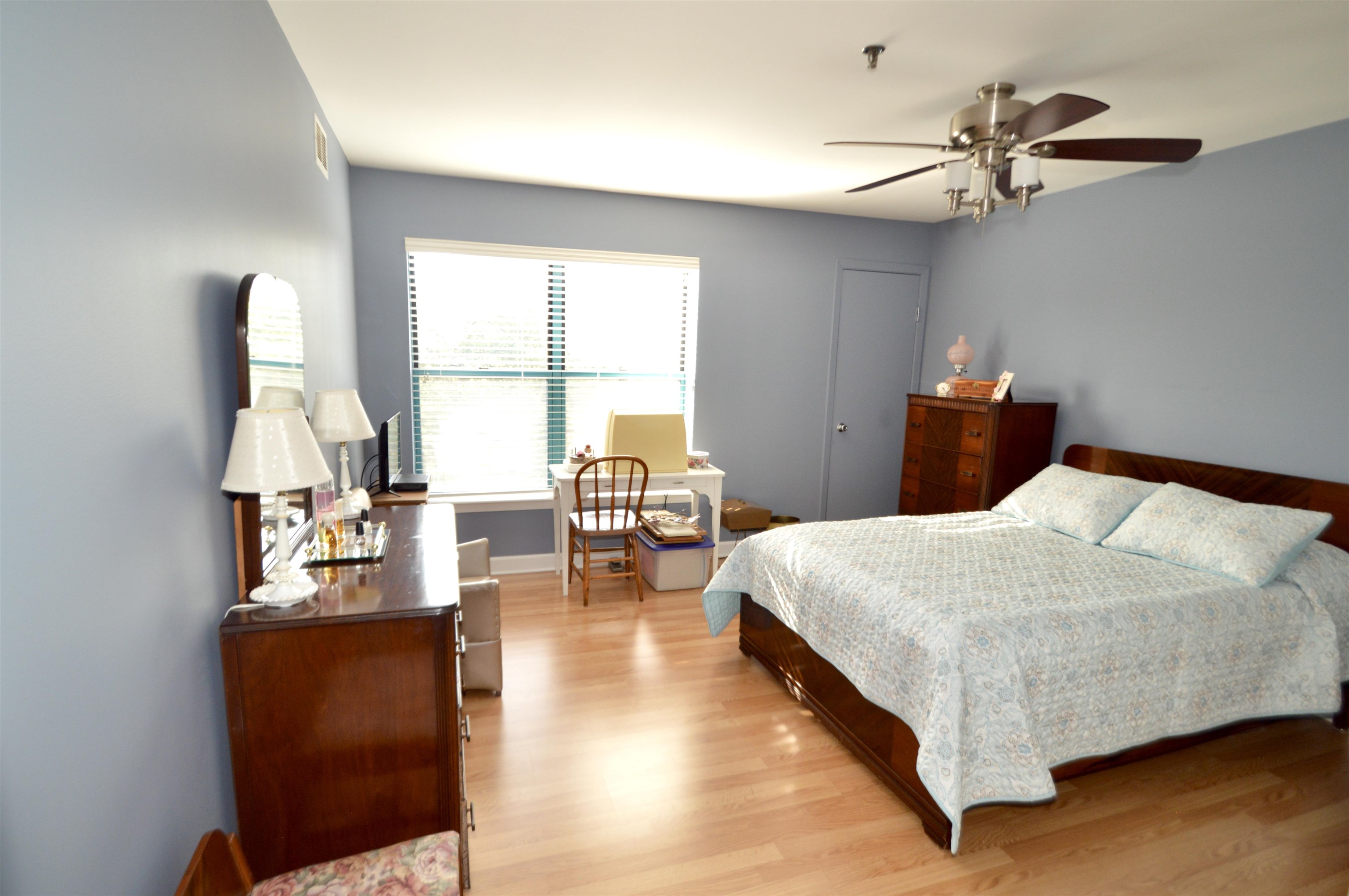 3265 Kirchoff Road Rolling Meadows, IL 60008 - Photo 8 of 14 a bed room with a bed and a chair