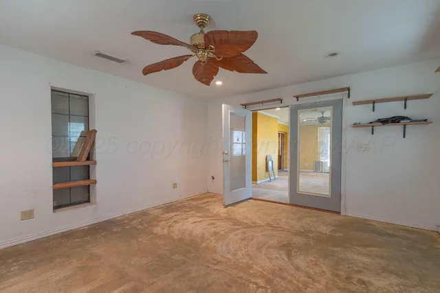 a view of a backyard with large trees