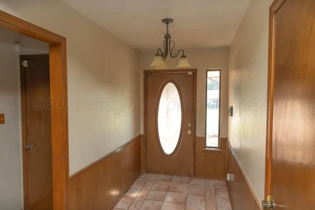 a view of a bathroom with a shower and mirror
