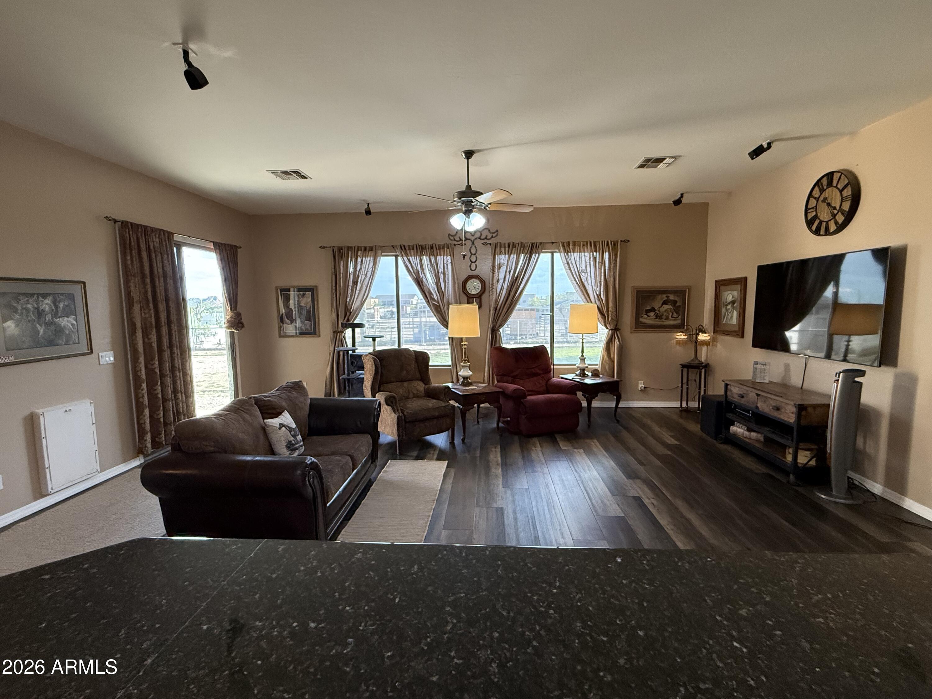 2569 West Silverdale Road San Tan Valley, AZ 85144 - Photo 2 of 61 a living room with furniture and a fireplace