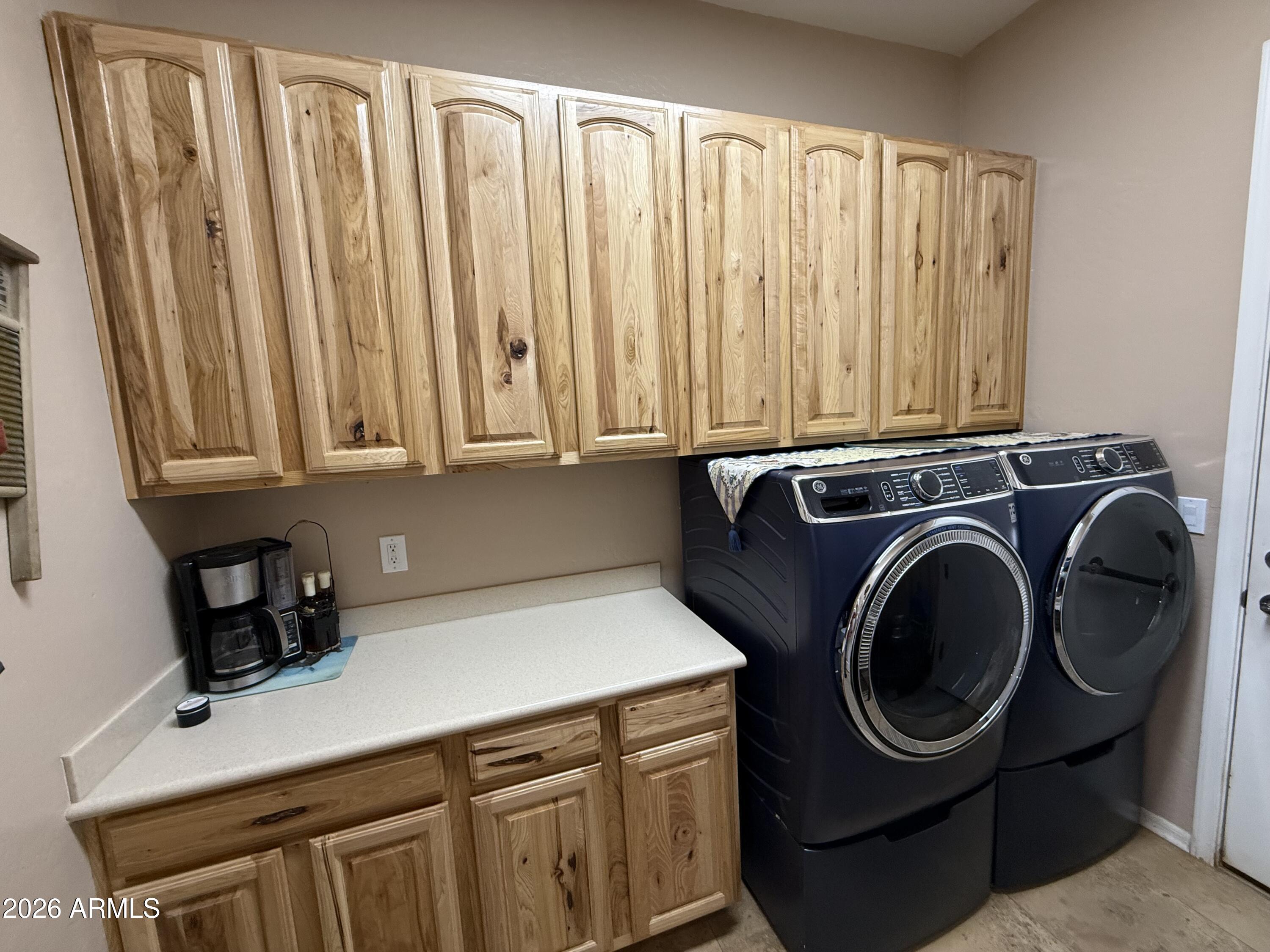 2569 West Silverdale Road San Tan Valley, AZ 85144 - Photo 27 of 61 a utility room with sink dryer and washer