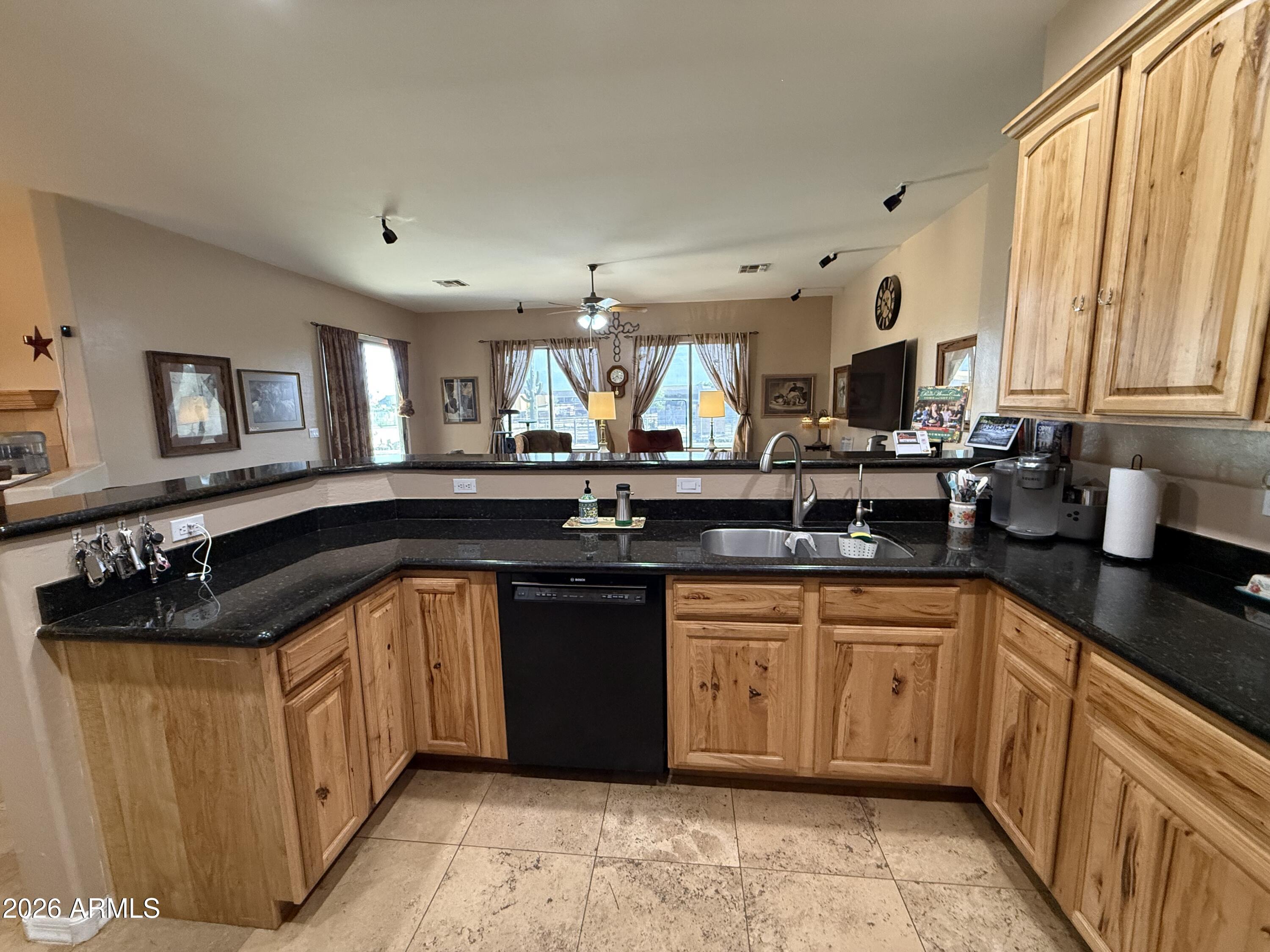 2569 West Silverdale Road San Tan Valley, AZ 85144 - Photo 29 of 61 a kitchen with a sink and cabinets