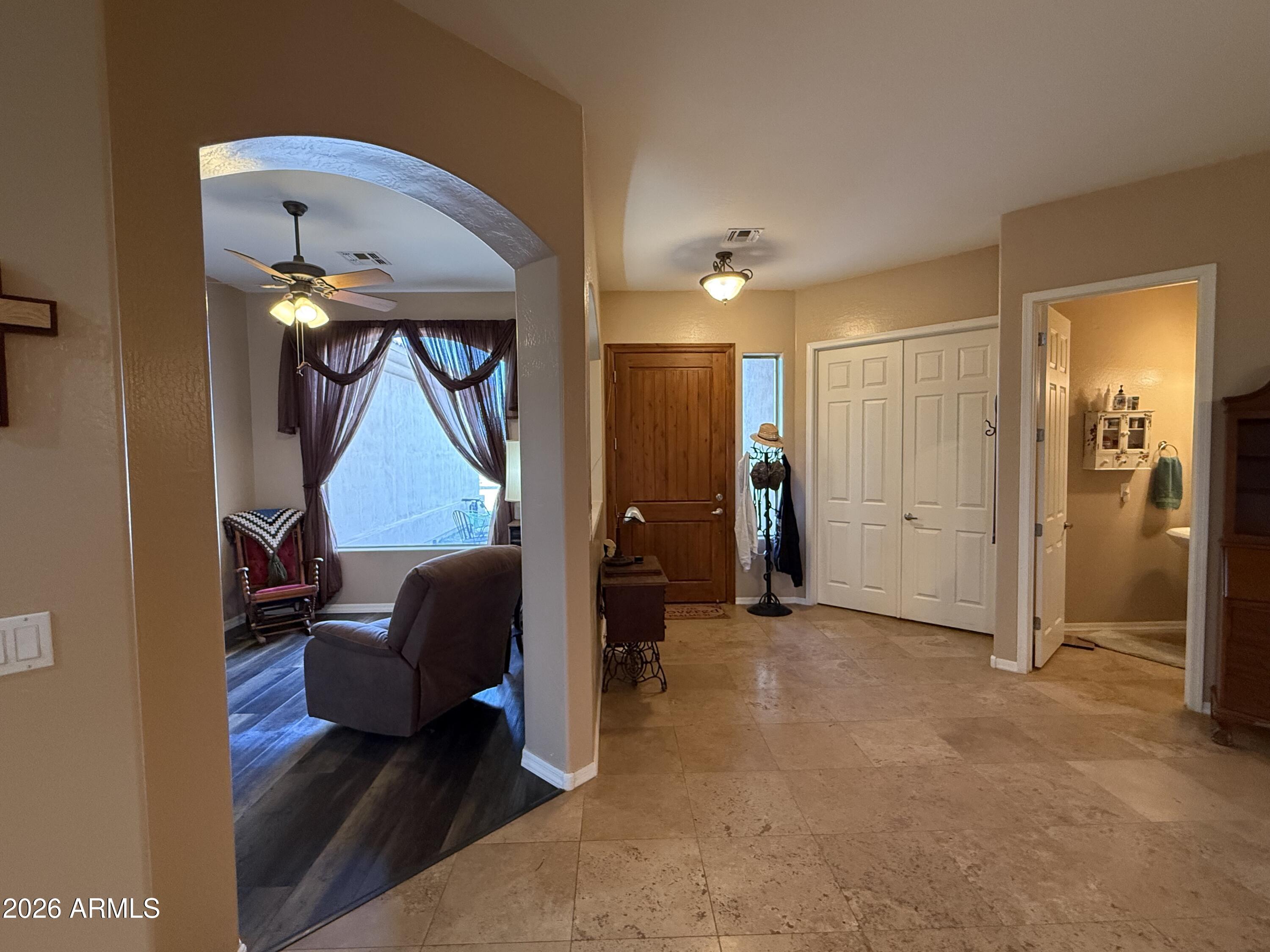 2569 West Silverdale Road San Tan Valley, AZ 85144 - Photo 30 of 61 a living room with furniture and a gate