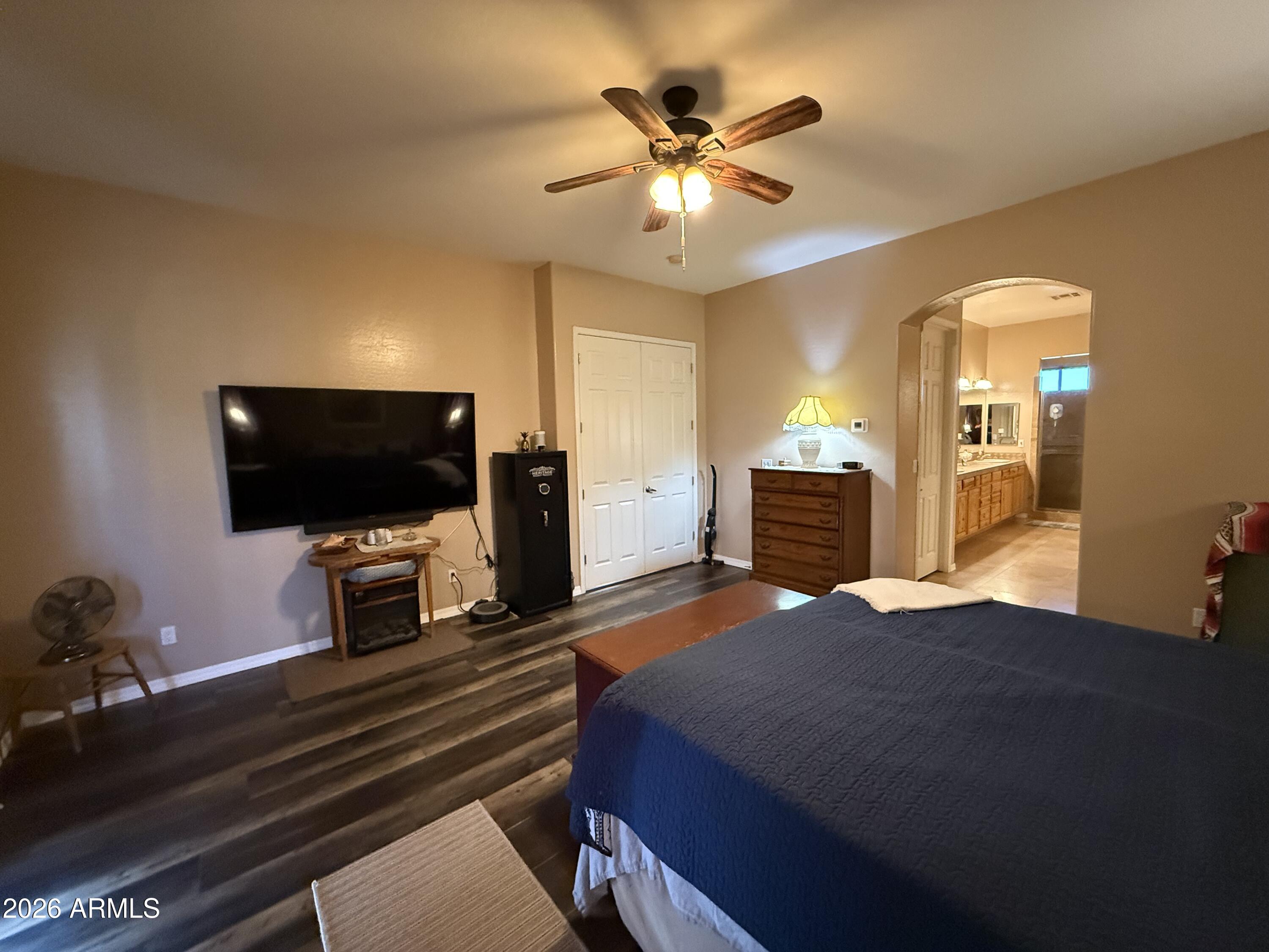 2569 West Silverdale Road San Tan Valley, AZ 85144 - Photo 32 of 61 a bedroom with a bed and a flat screen tv