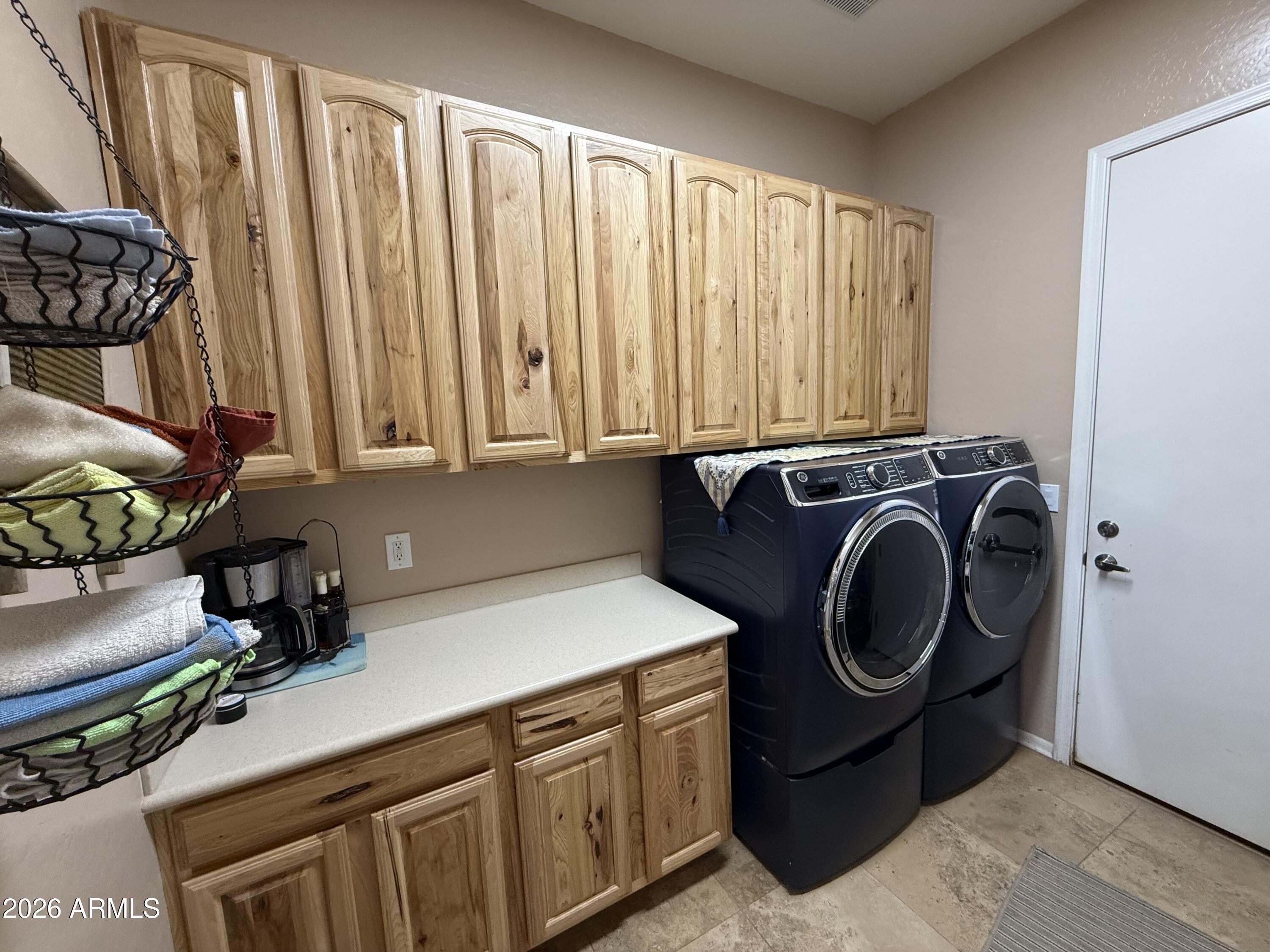 2569 West Silverdale Road San Tan Valley, AZ 85144 - Photo 39 of 61 a utility room with sink dryer and washer