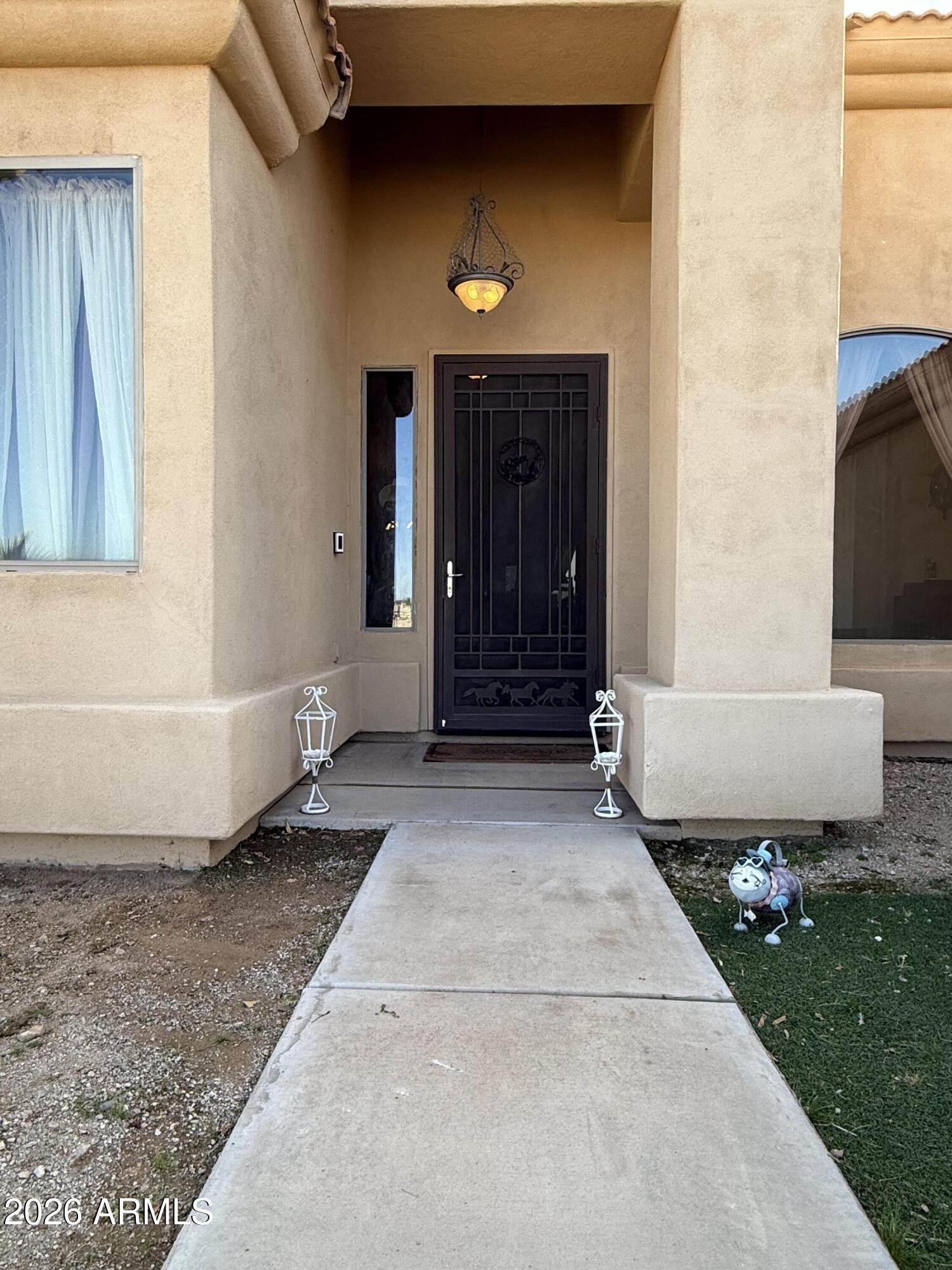 2569 West Silverdale Road San Tan Valley, AZ 85144 - Photo 41 of 61 a front view of a house with a yard