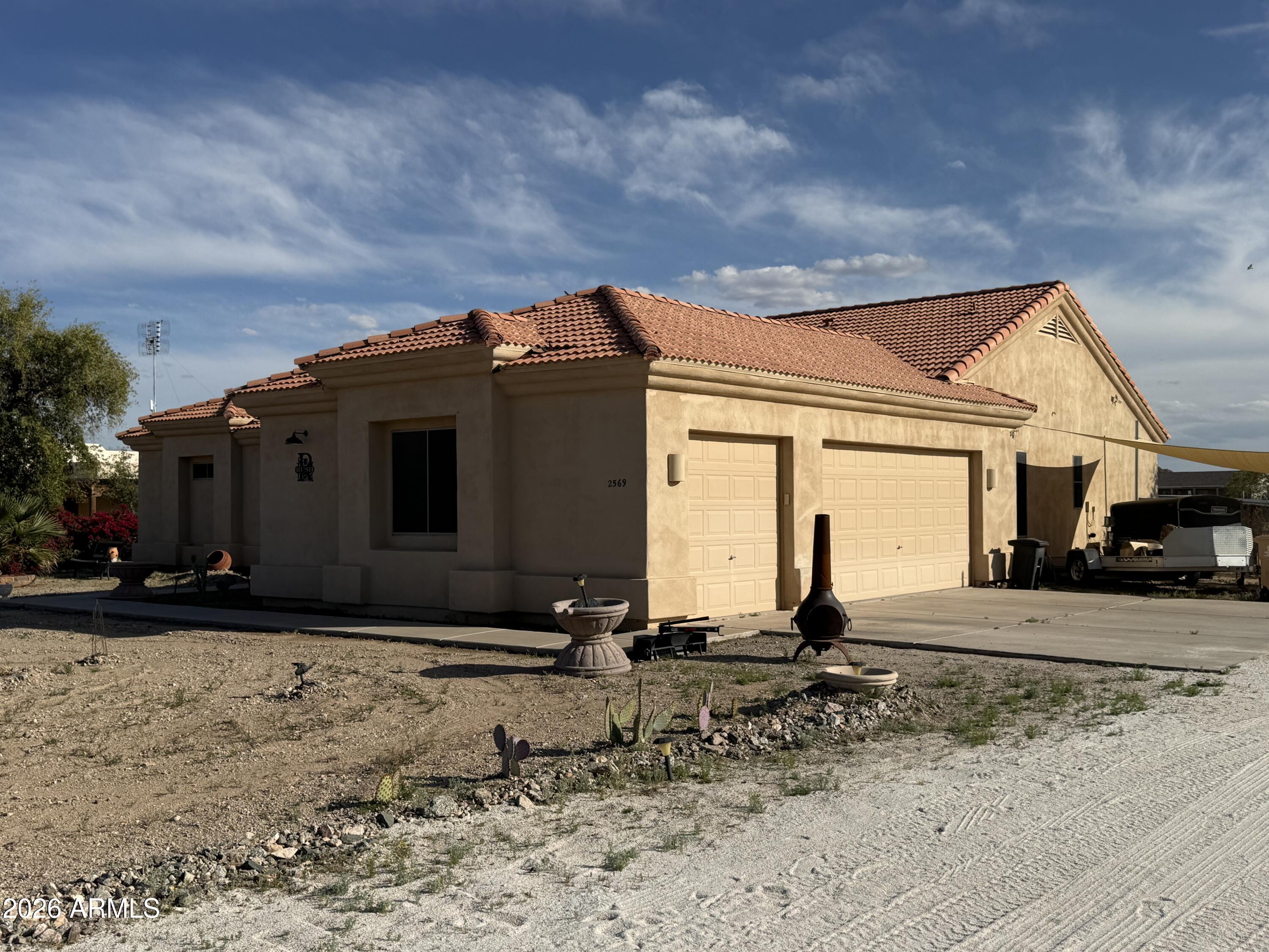 2569 West Silverdale Road San Tan Valley, AZ 85144 - Photo 43 of 61 a view of a house with a backyard