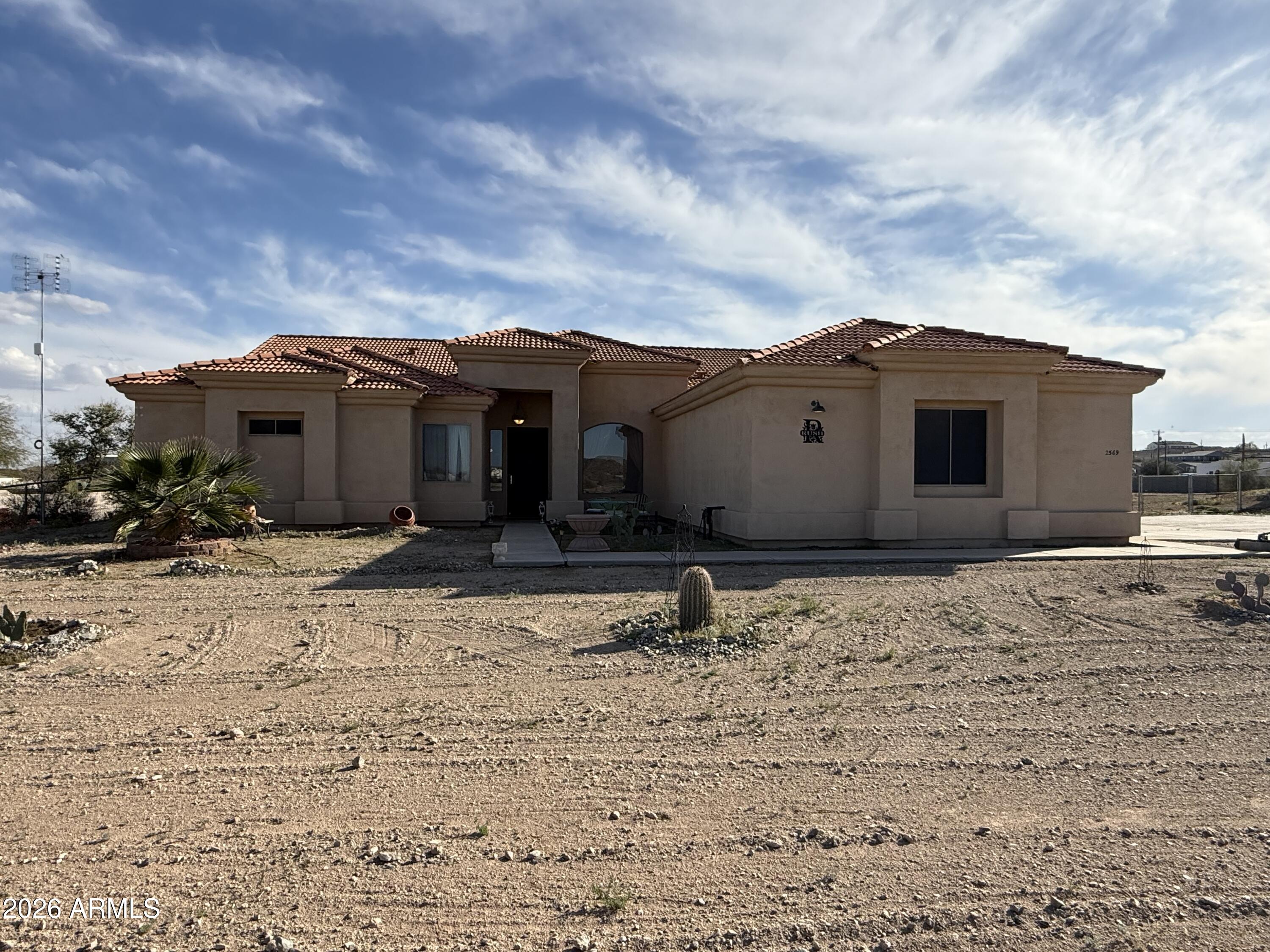 2569 West Silverdale Road San Tan Valley, AZ 85144 - Photo 45 of 61 a view of a house with a yard