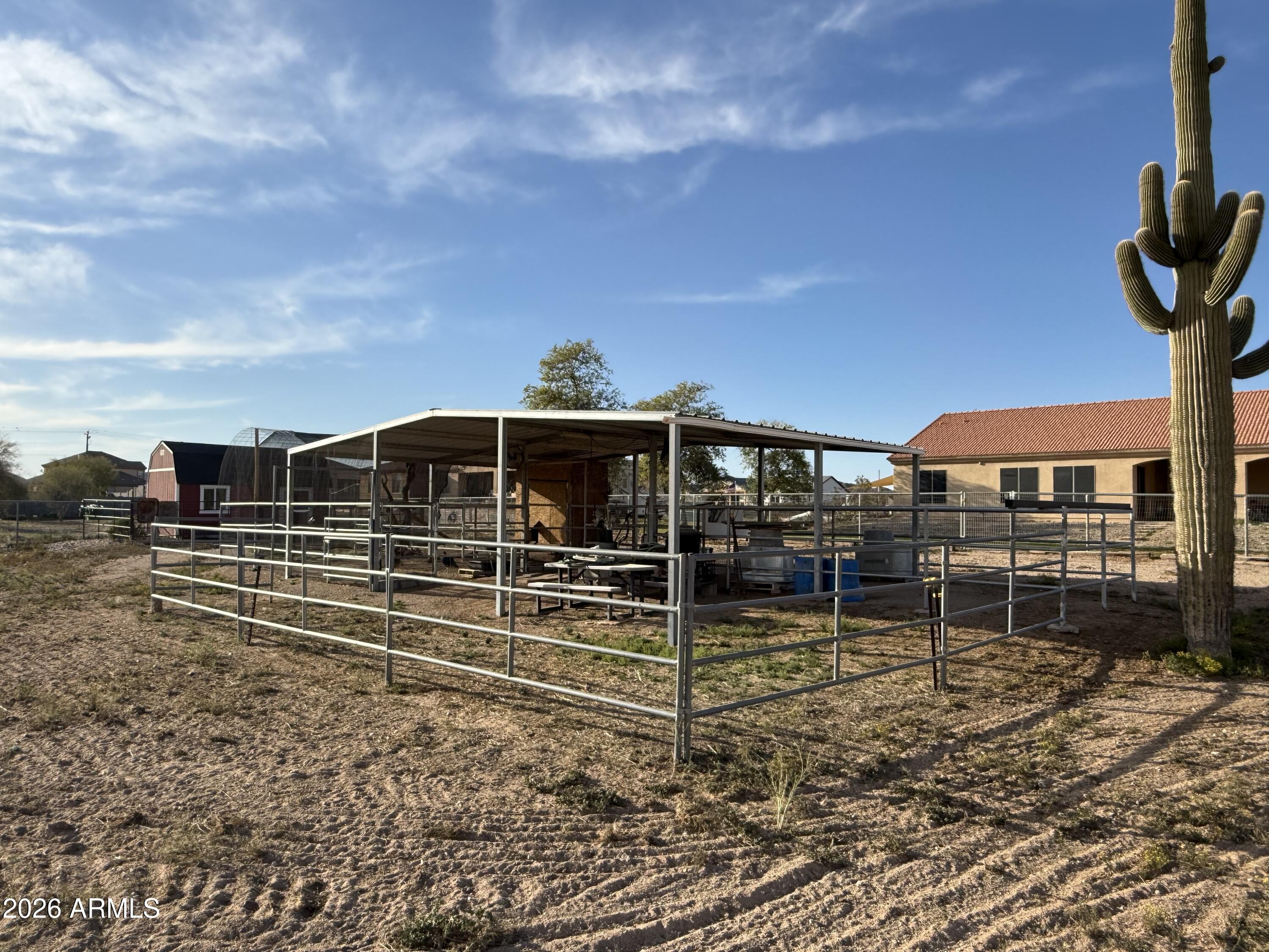 2569 West Silverdale Road San Tan Valley, AZ 85144 - Photo 54 of 61 a view of a house with a yard