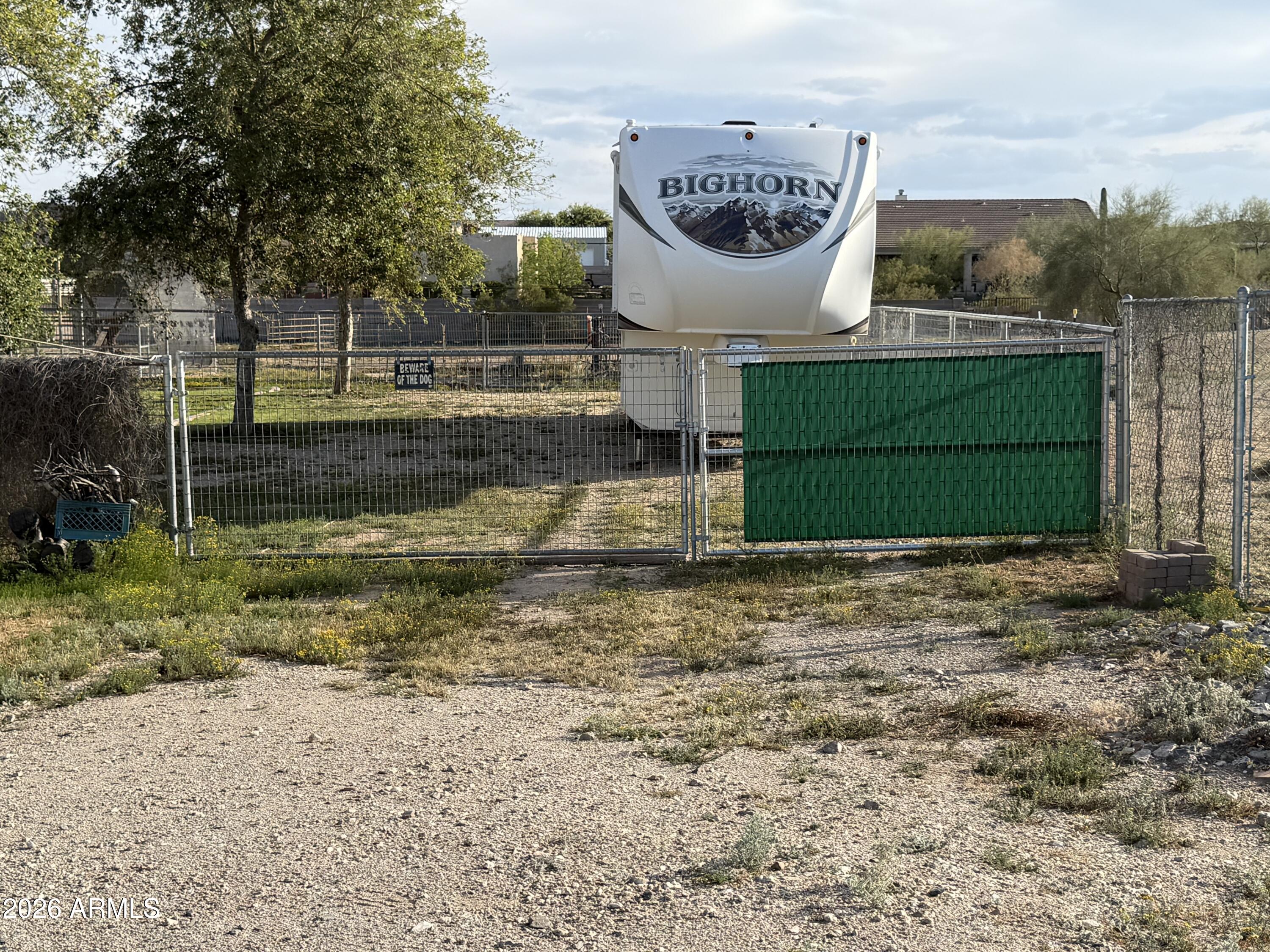 2569 West Silverdale Road San Tan Valley, AZ 85144 - Photo 61 of 61 a sign that is sitting in the middle of a yard