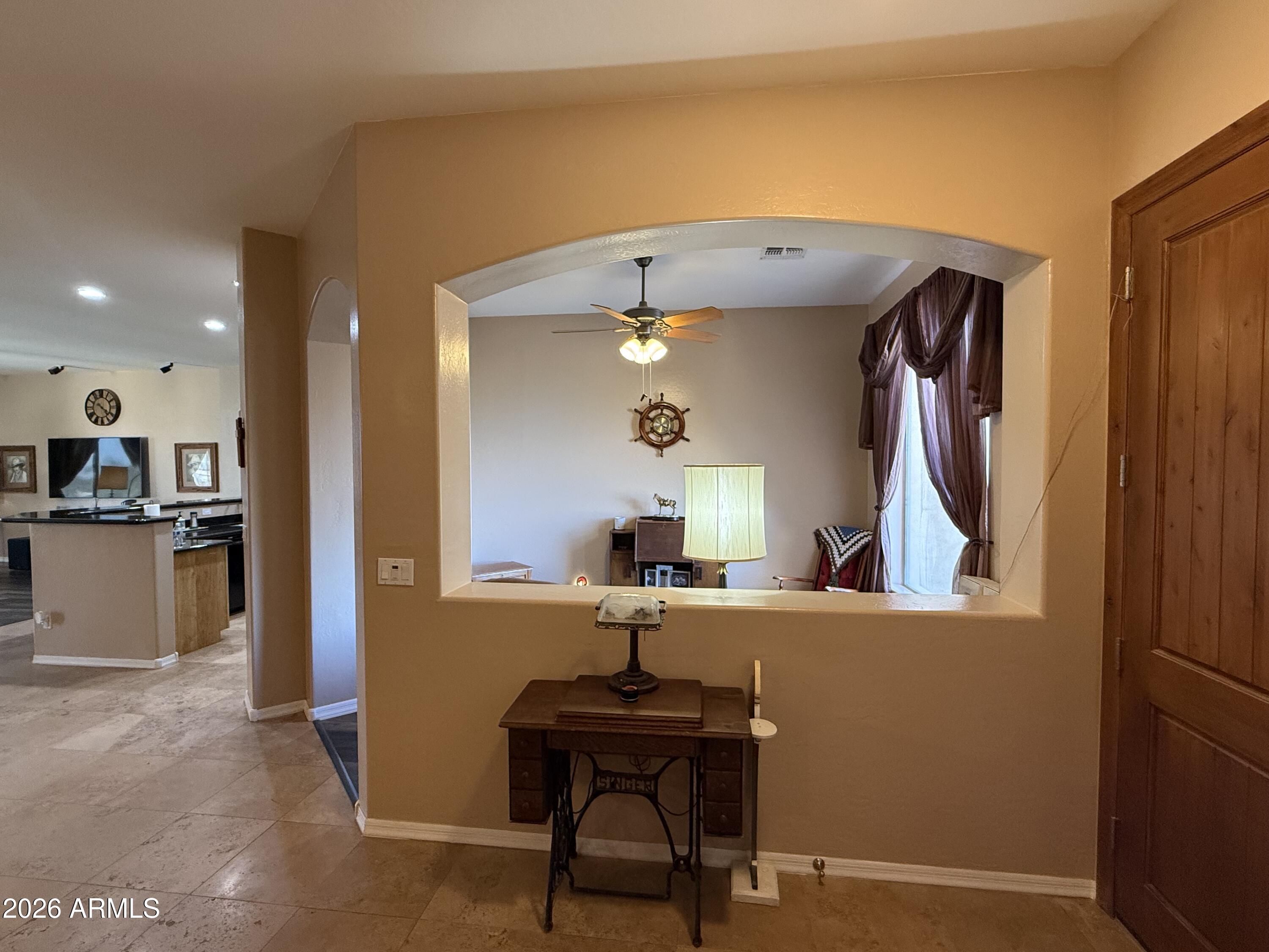 2569 West Silverdale Road San Tan Valley, AZ 85144 - Photo 10 of 61 a view of a kitchen with a sink and a refrigerator