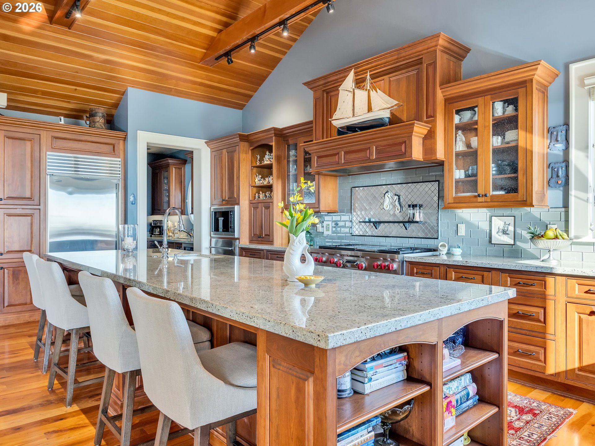 89079 Pinehurst Road Warrenton, OR 97146 - Photo 21 of 46 a kitchen with a table chairs and a dining table