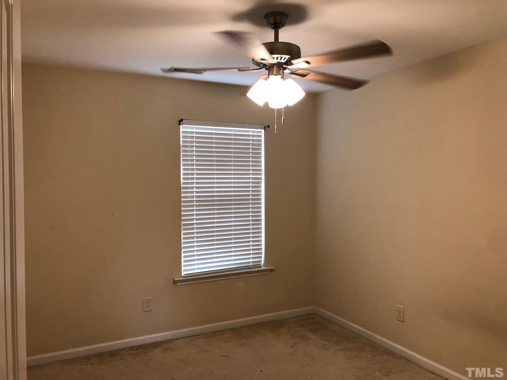 4252 Brintons Cottage Street Raleigh, NC 27616 - Photo 14 of 19 a view of a room with a window and a fan