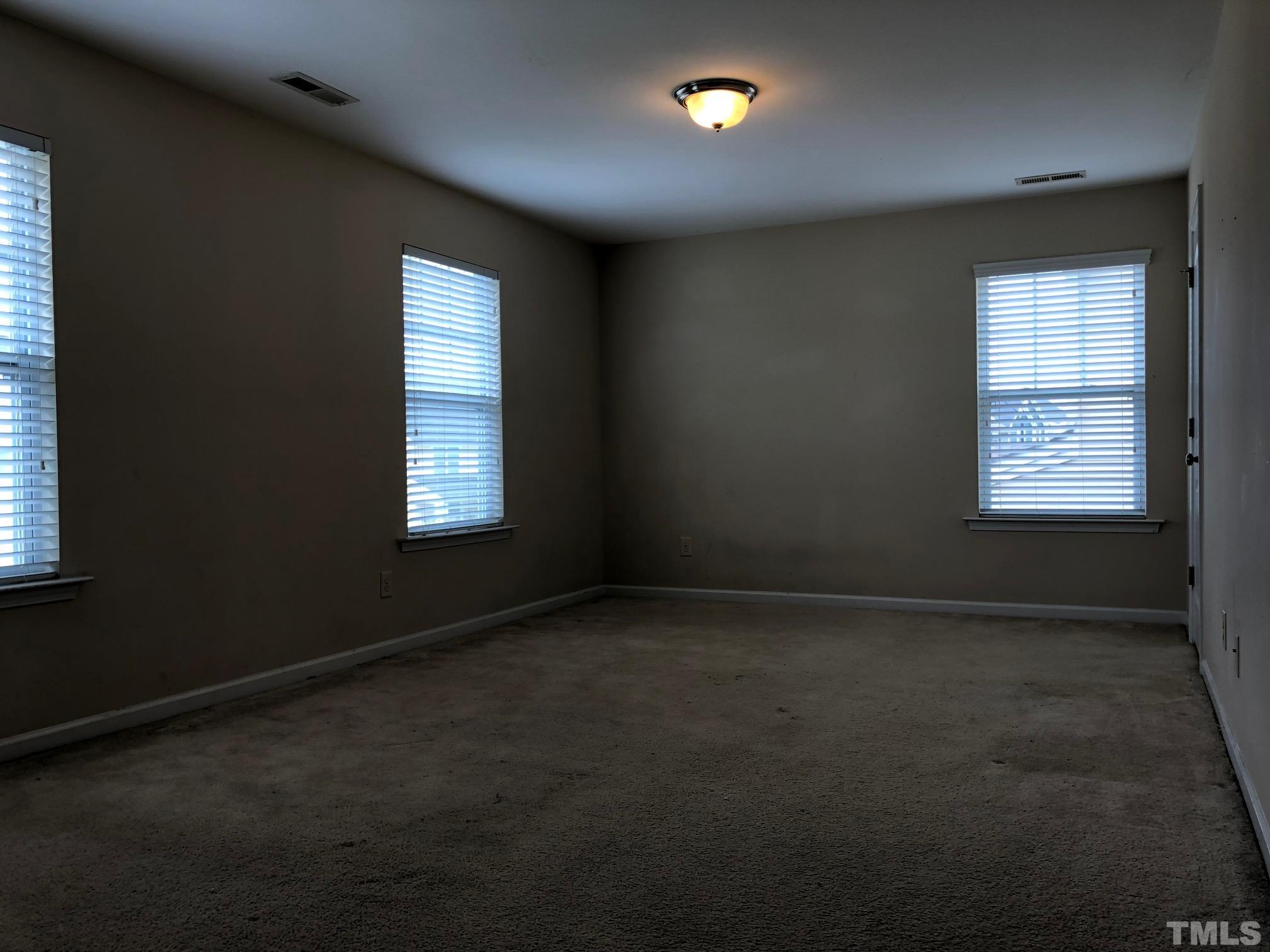 4252 Brintons Cottage Street Raleigh, NC 27616 - Photo 17 of 19 an empty room with windows