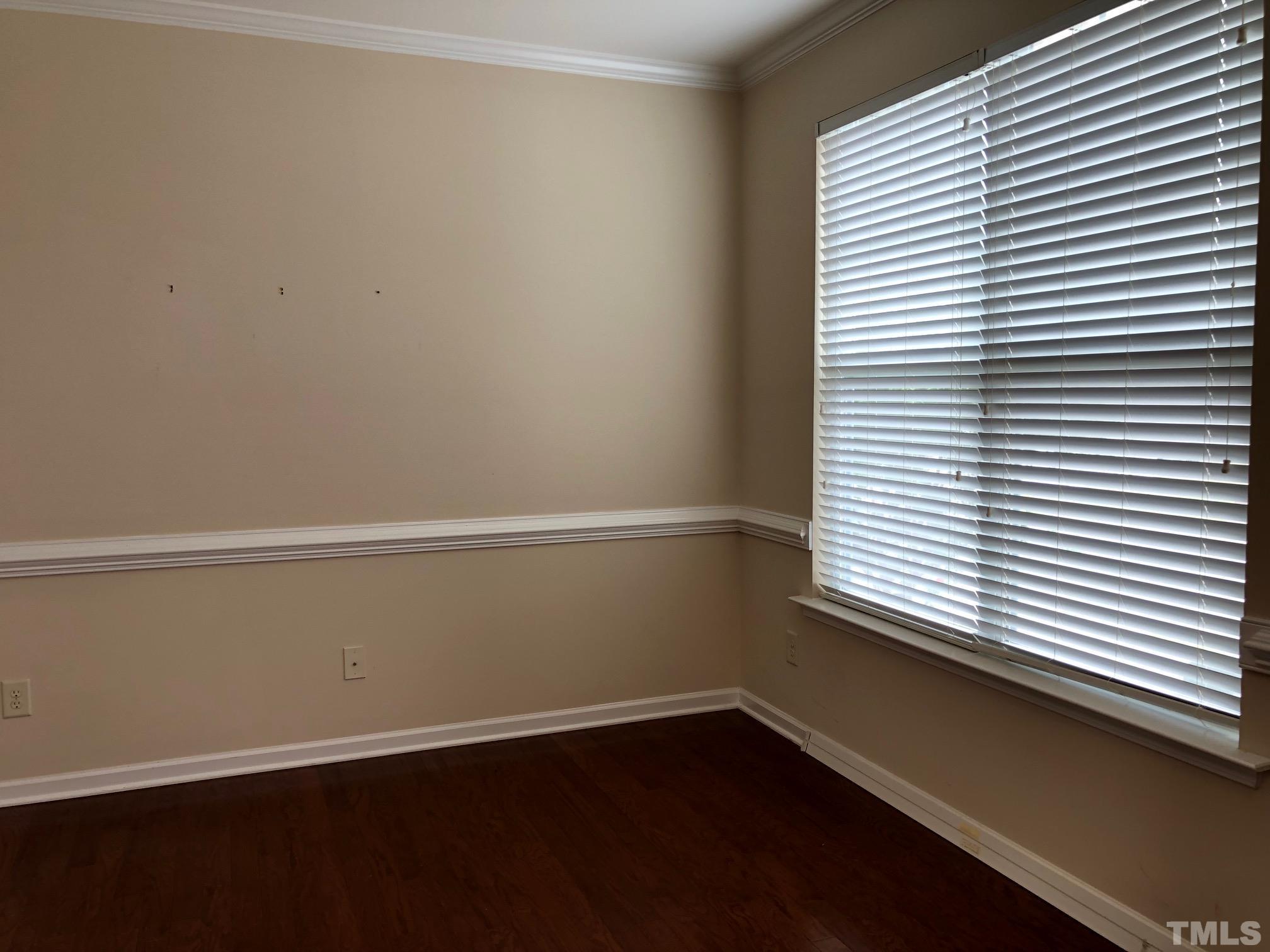 4252 Brintons Cottage Street Raleigh, NC 27616 - Photo 3 of 19 a view of a small space with wooden floor and a window