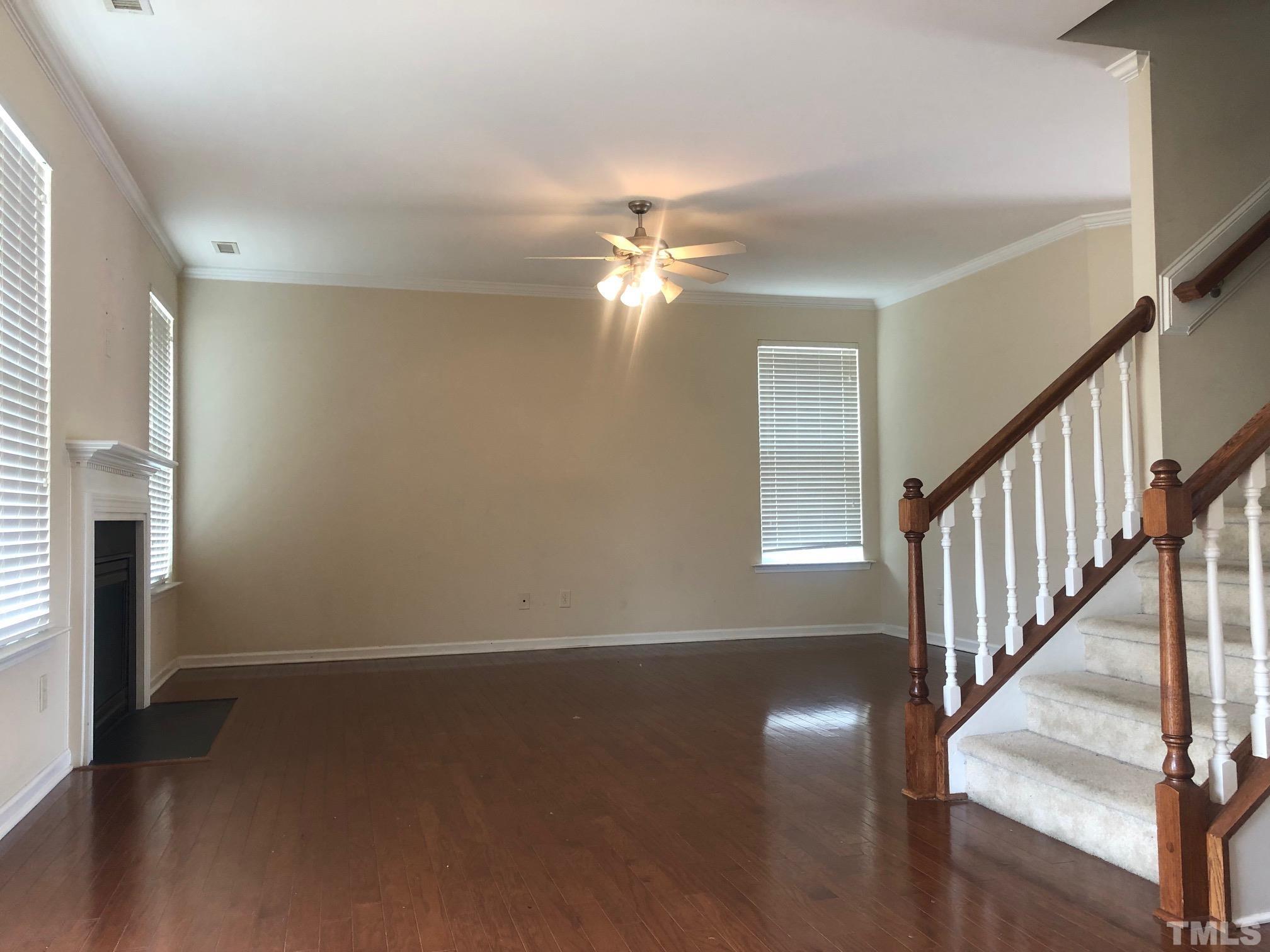 4252 Brintons Cottage Street Raleigh, NC 27616 - Photo 4 of 19 wooden floor in an empty room with a window