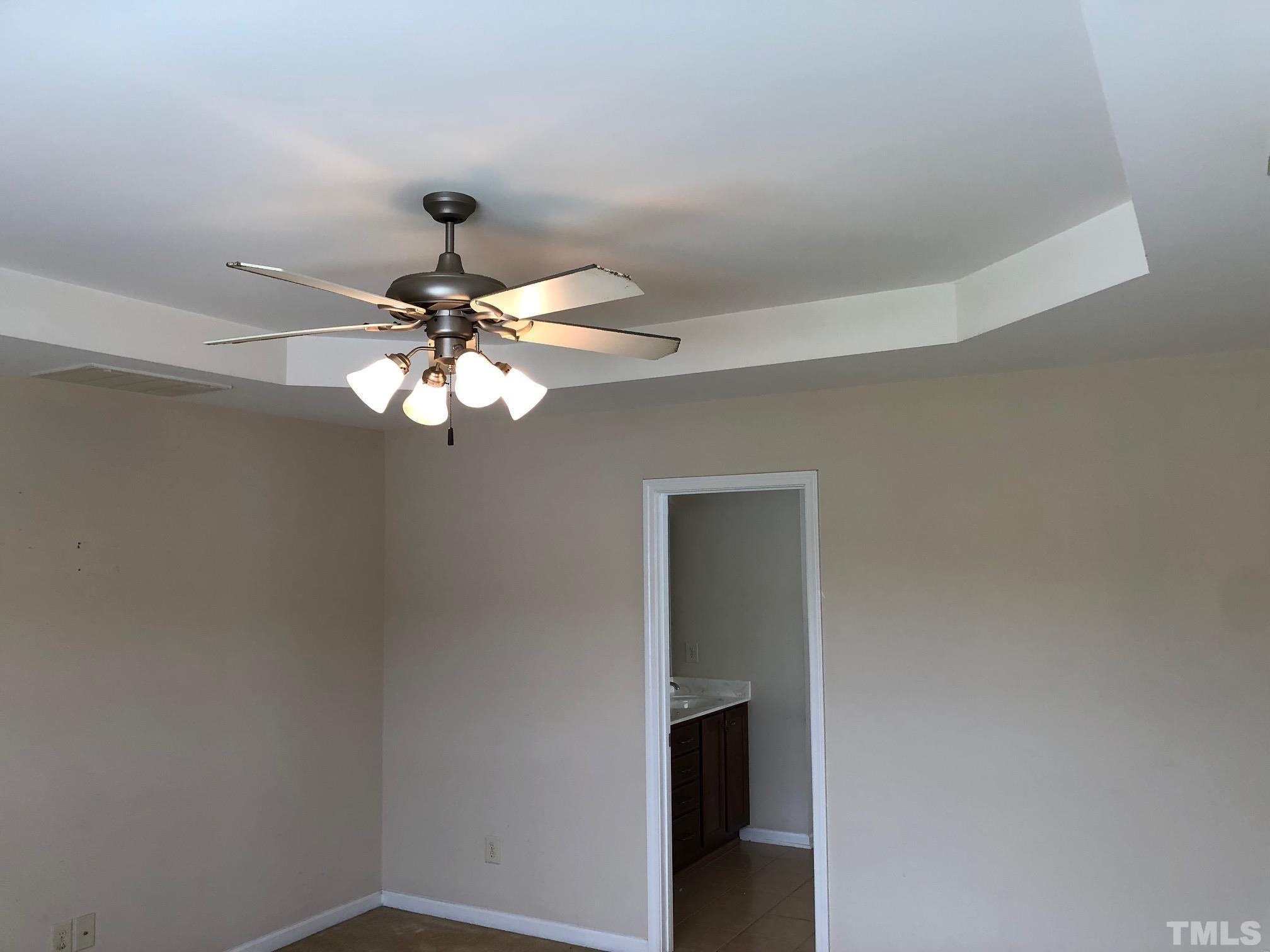 4252 Brintons Cottage Street Raleigh, NC 27616 - Photo 10 of 19 a light fixture a ceiling fan and a window