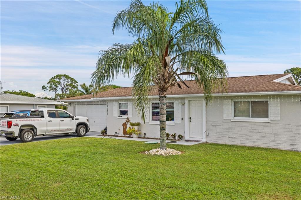 19121 Acorn Road Fort Myers, FL 33967 - Photo 6 of 23 Ranch-style home featuring a front yard and a garage