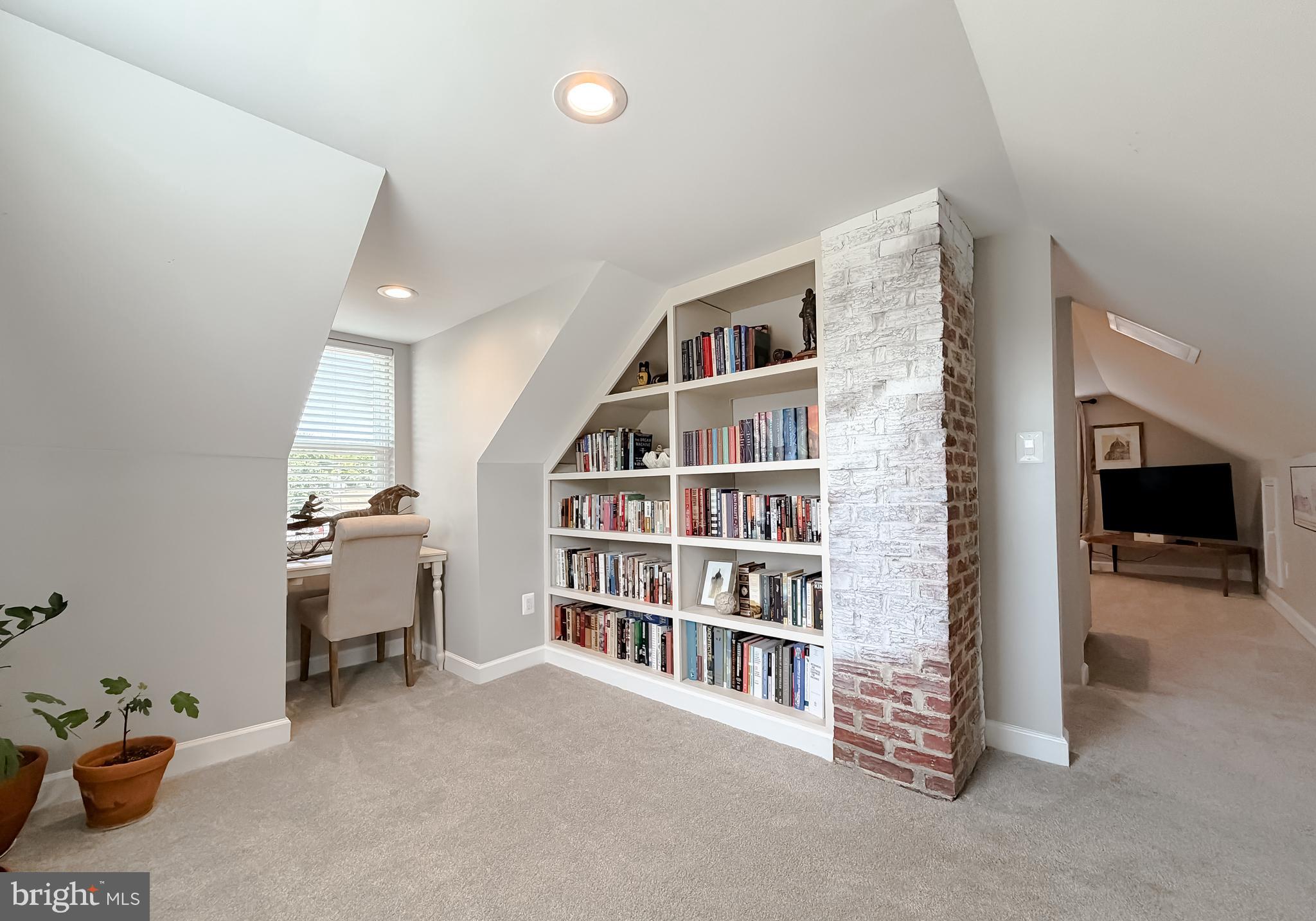 4985 Solomons Island Road Huntingtown, MD 20639 - Photo 25 of 50 a view of a livingroom with a book shelf