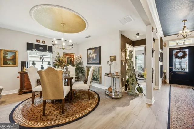 a view of a livingroom with furniture and a floor to ceiling window