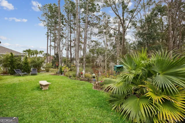 a backyard of a house with lots of green space