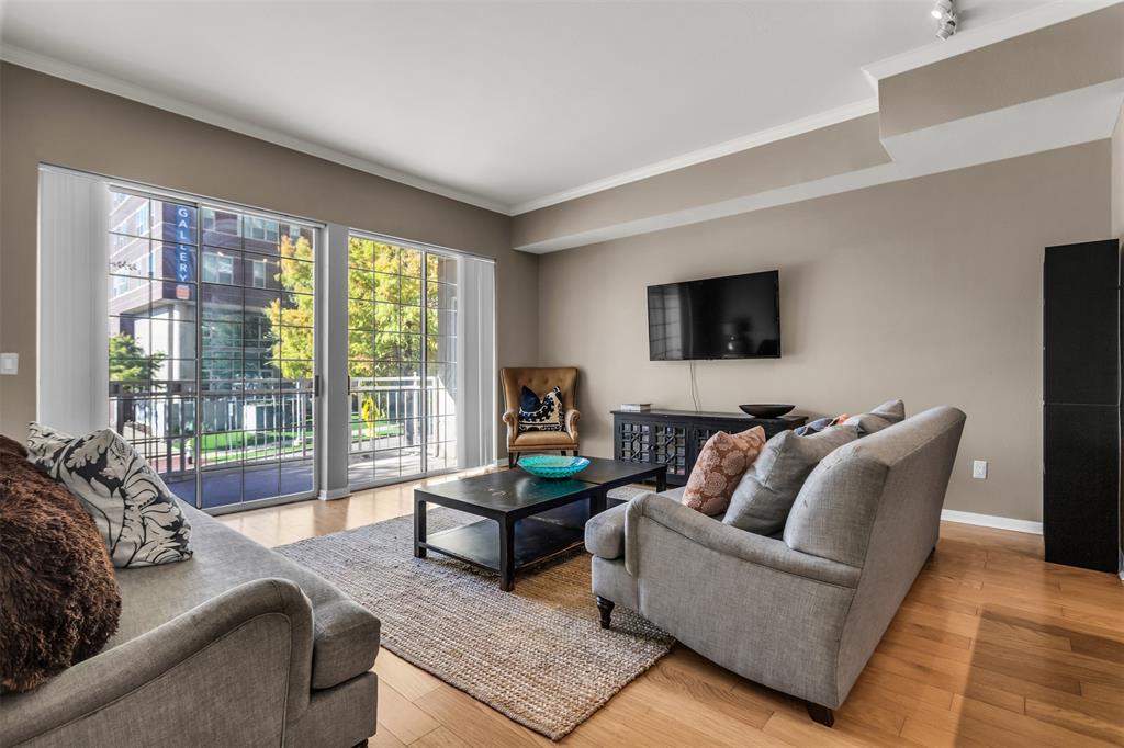 3225 Turtle Creek Boulevard, Unit 10 Dallas, TX 75219 - Photo 16 of 38 Living room with crown molding and light wood-type flooring