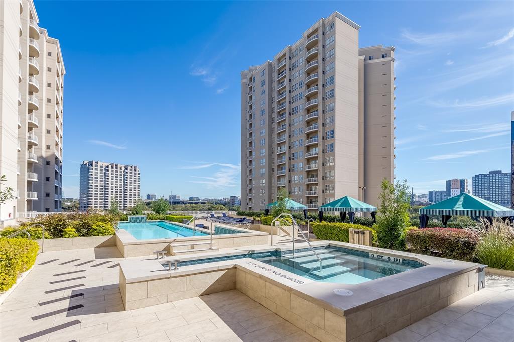 3225 Turtle Creek Boulevard, Unit 10 Dallas, TX 75219 - Photo 22 of 38 Community pool with a hot tub, a patio, and a view of city