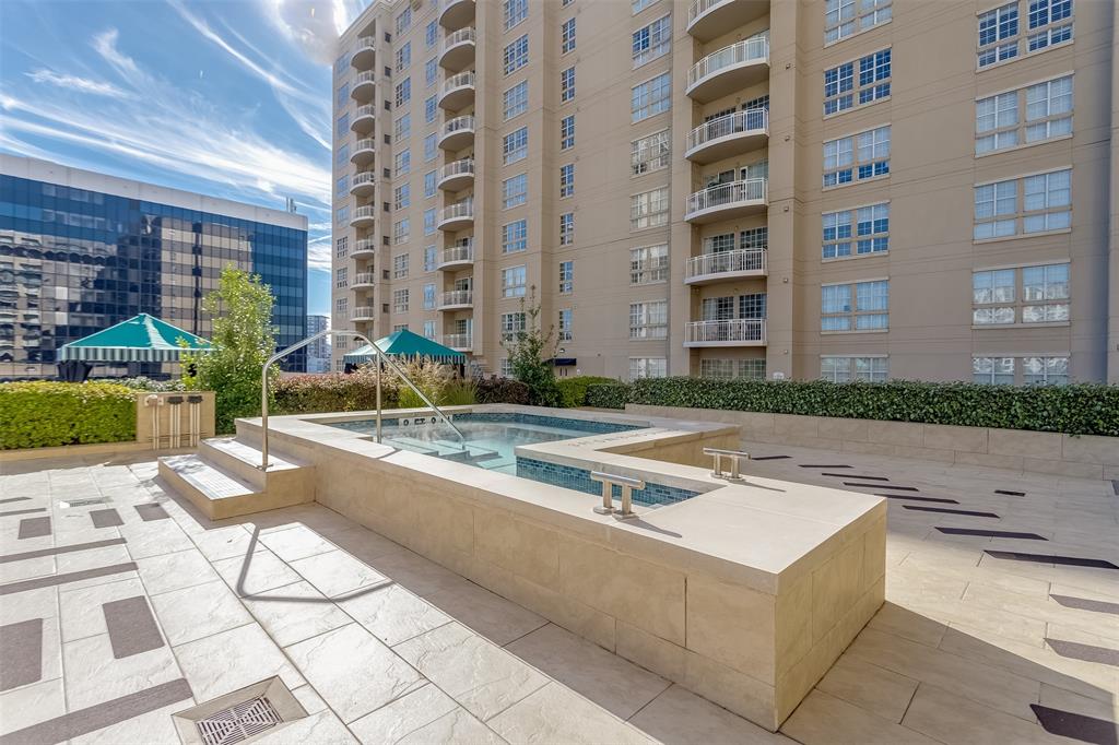 3225 Turtle Creek Boulevard, Unit 10 Dallas, TX 75219 - Photo 26 of 38 View of swimming pool featuring a community hot tub and a patio area