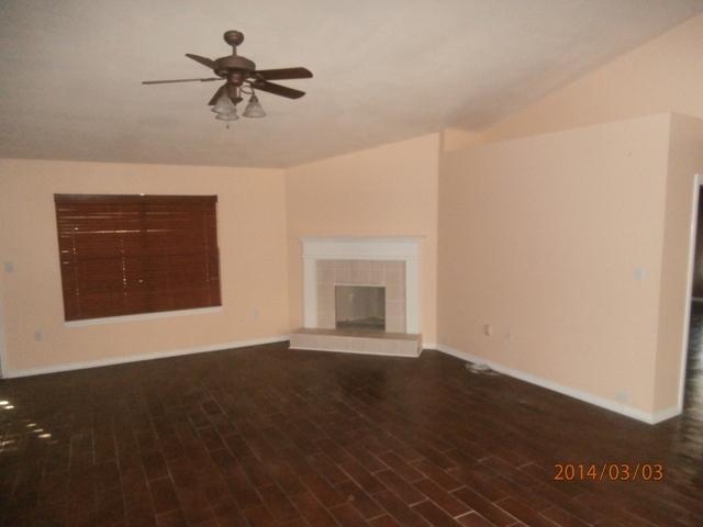 43 Beacon Way Santa Rosa Beach, FL 32459 - Photo 2 of 19 a view of wooden floor and a chandelier fan in an empty room