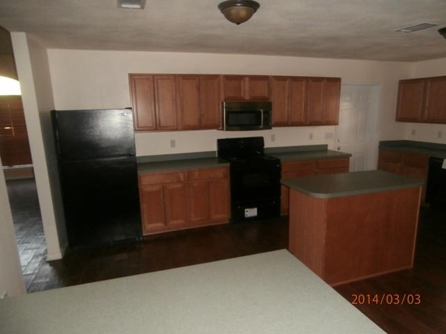 43 Beacon Way Santa Rosa Beach, FL 32459 - Photo 3 of 19 a kitchen with stainless steel appliances wooden cabinets and a counter top space